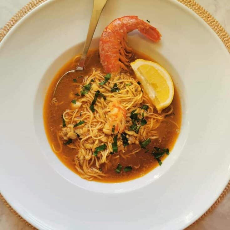 Fresh shrimp noodle soup with lemon wedge and herbs at The Olive Branch Nest.