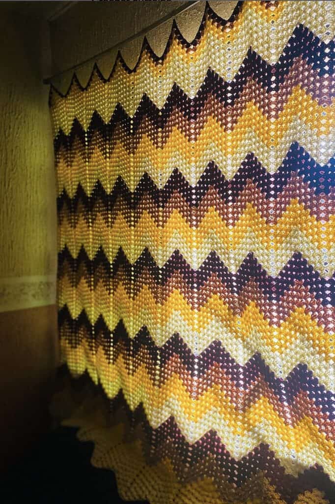 Colorful handmade crochet blanket with zigzag pattern at The Olive Branch Nest.