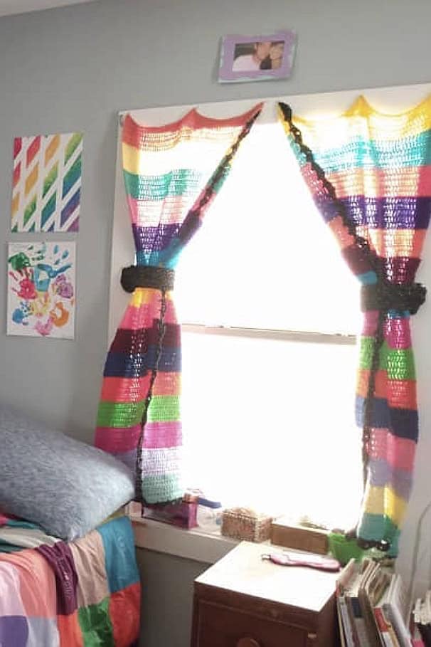 Colorful striped curtains in a cozy bedroom at The Olive Branch Nest.