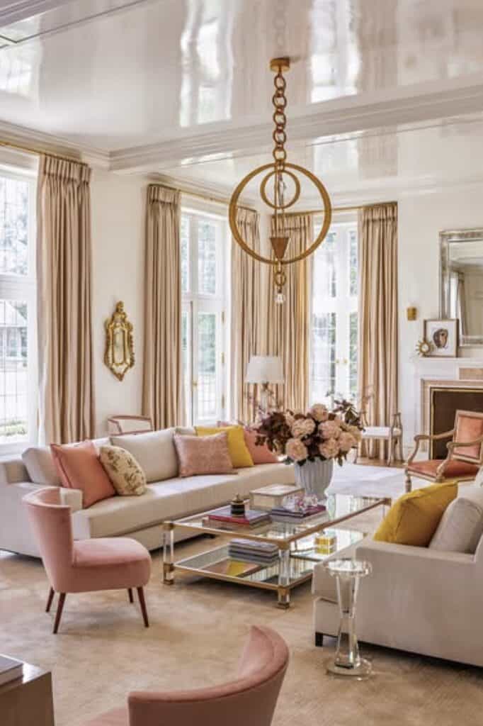 Beautiful living space featuring plush sofas, soft curtains, and stunning floral decor.