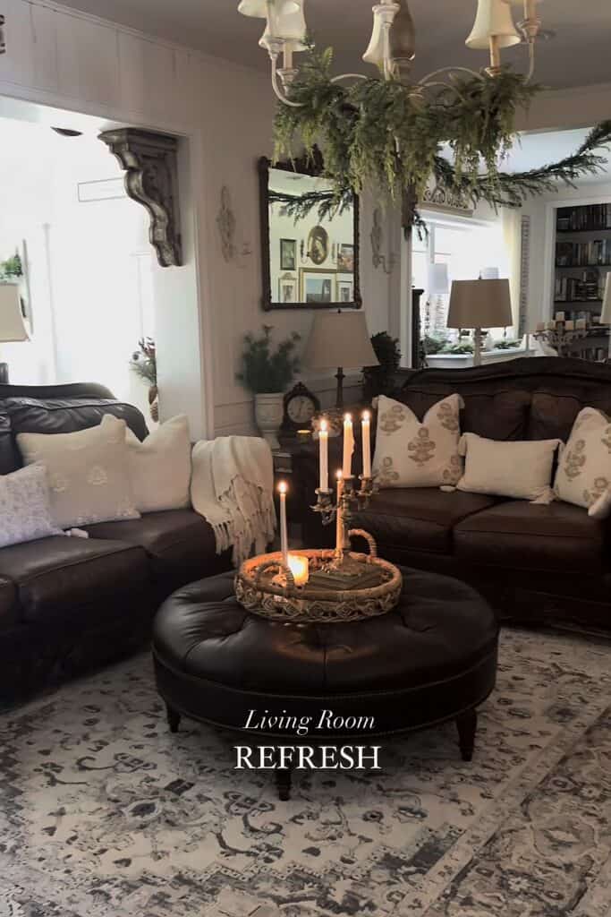 Living room interior with festive candles, cushions, and holiday decor for a warm, inviting ambiance.