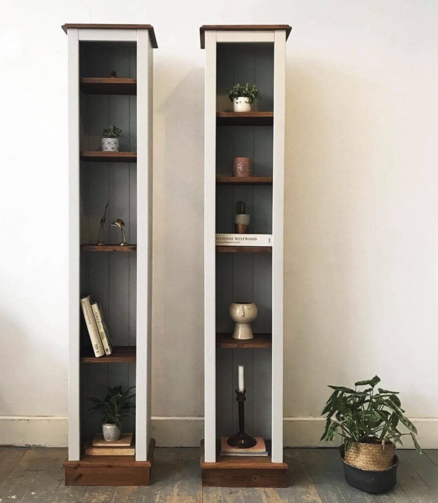 Decorative wooden display shelves with potted plants and books for living spaces.