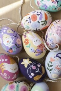 Decorative hand-painted Easter eggs with floral, bunny, and nature designs for spring celebrations.