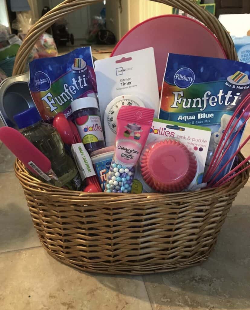 Vibrant baking-themed gift basket with colorful cake mixes and tools