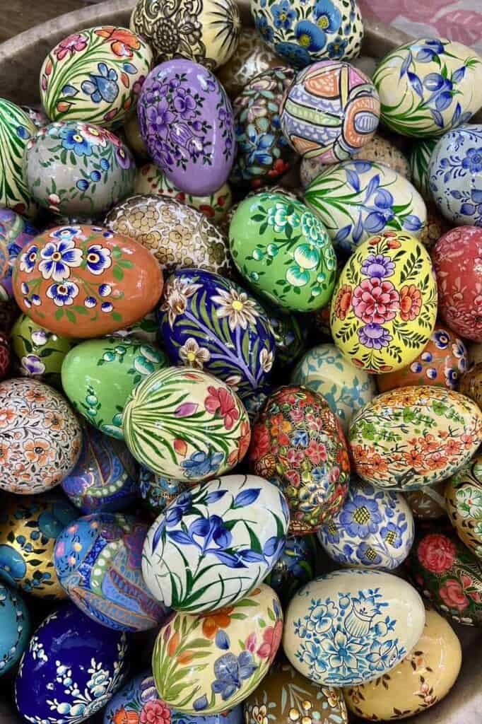 Vibrant decorated Easter eggs with floral designs for spring celebration, artisanal craft.
