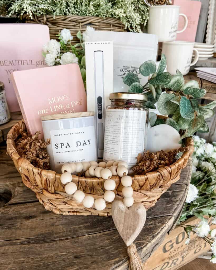 Beautiful Mother's Day gift basket with candles, eucalyptus, and spa items.