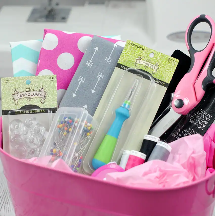 Complete sewing kit with fabric, scissors, pins, and thread for crafting projects.