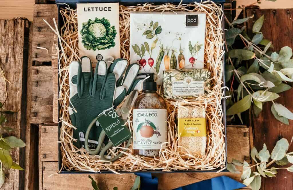 Beautiful garden-themed gift set with lettuce seed packet, gardening gloves, eco-friendly soap, and.