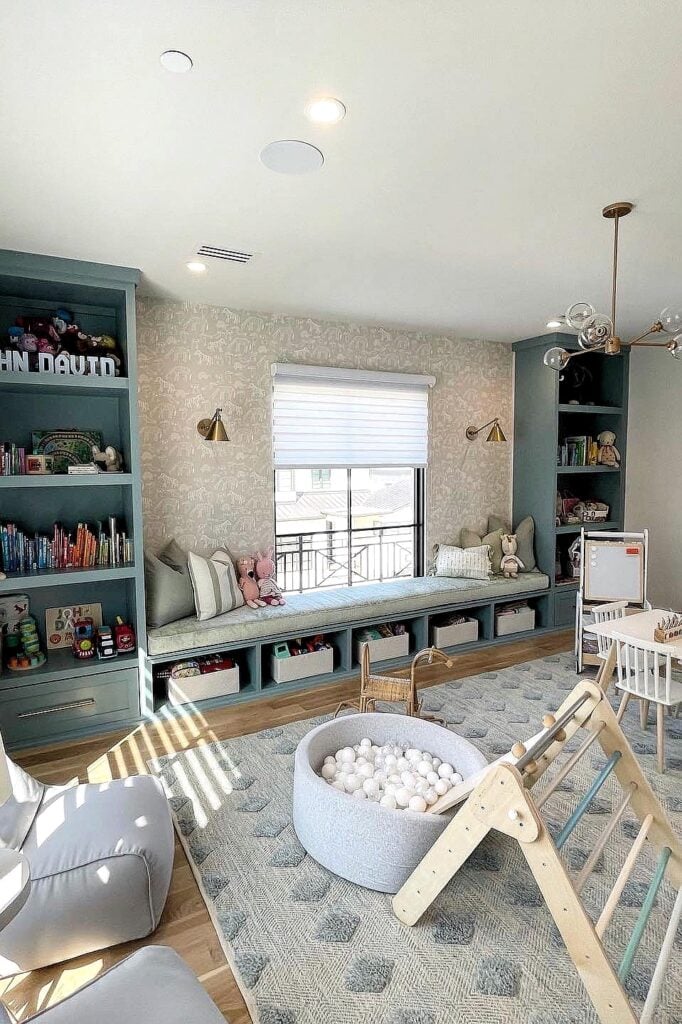Built-in playroom storage with cozy window seating and playful decor.