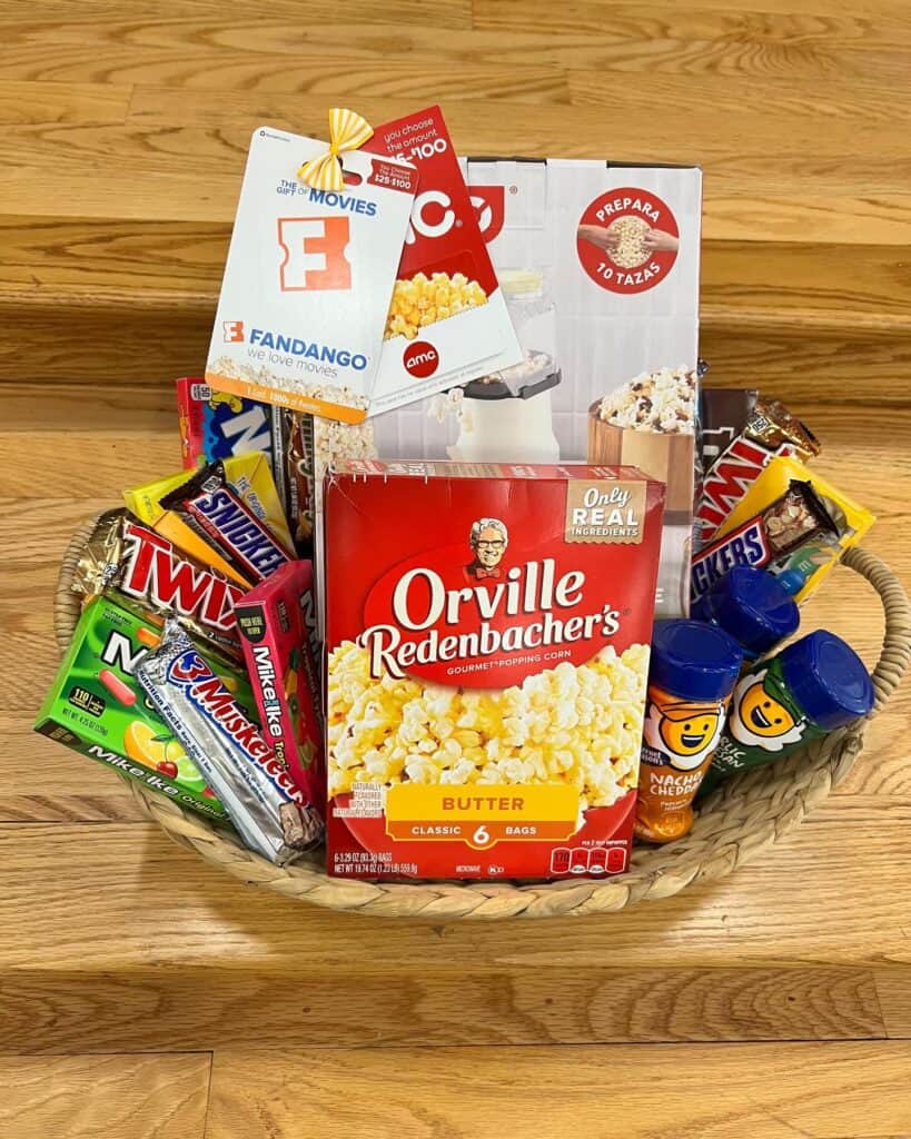 Gift basket with snacks, popcorn, and treats for Mother's Day celebration.