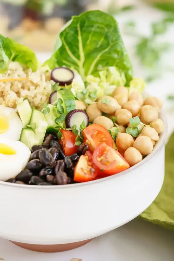 Healthy high-protein salad with chickpeas, vegetables, and greens for filling lunches.