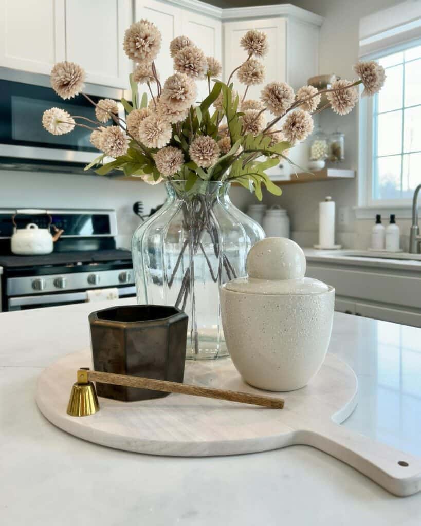 Beautiful floral arrangement with neutral decor in a bright kitchen setting.