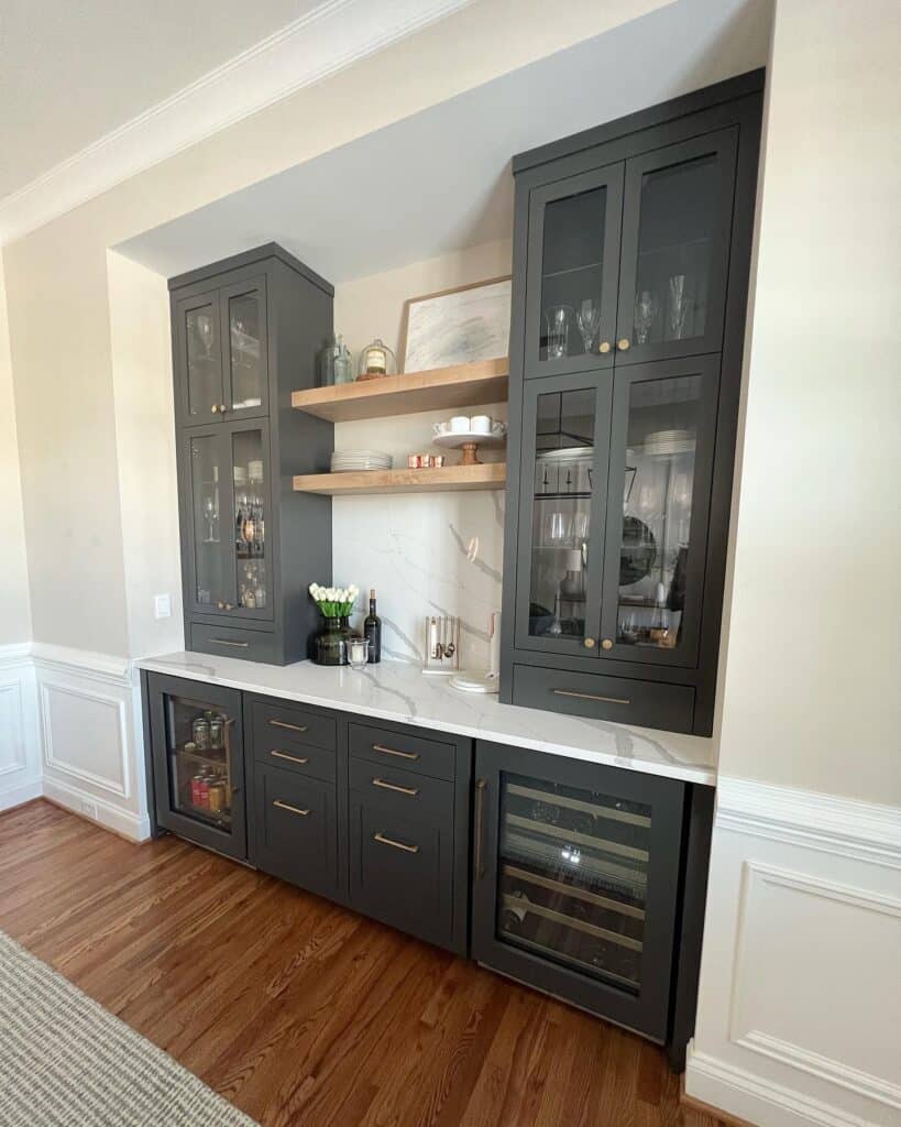 Dark gray kitchen bar cabinet with glass doors and open wooden shelves.