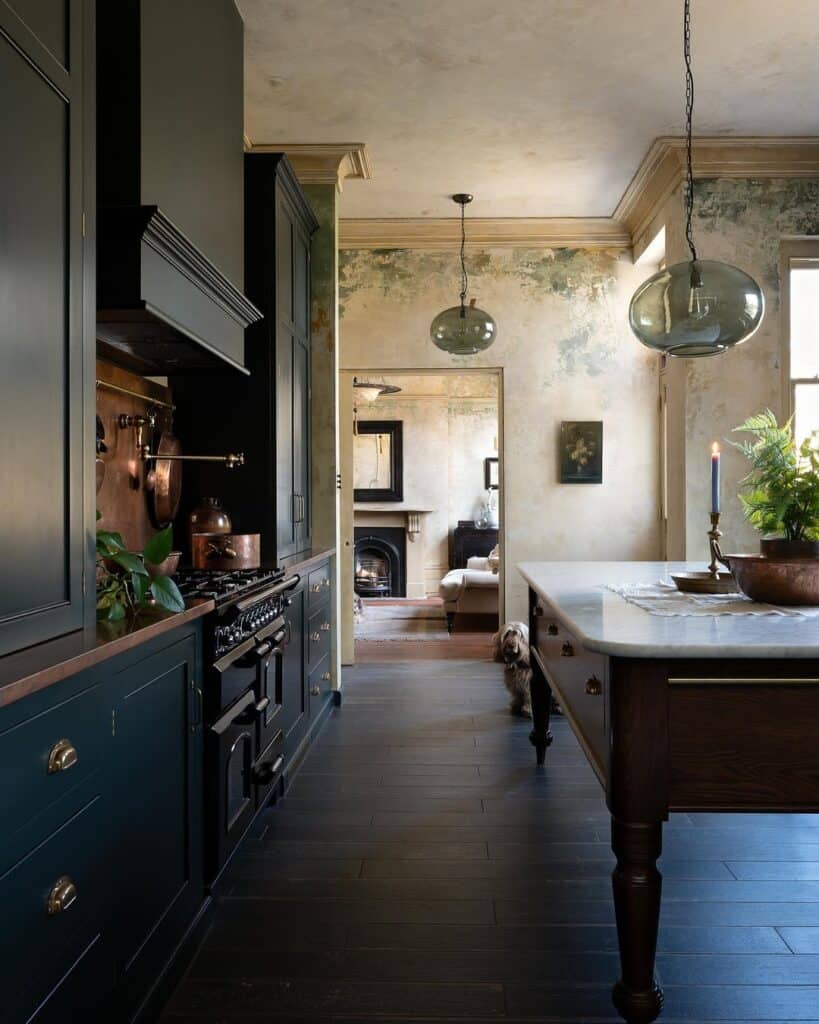 Modern black kitchen cabinets with vintage decor and natural light.