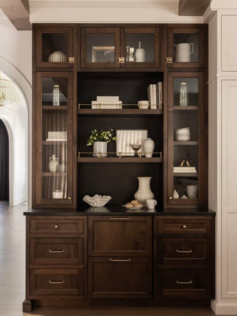 Beautiful dark wood hutch with decorative items and books for home decor.