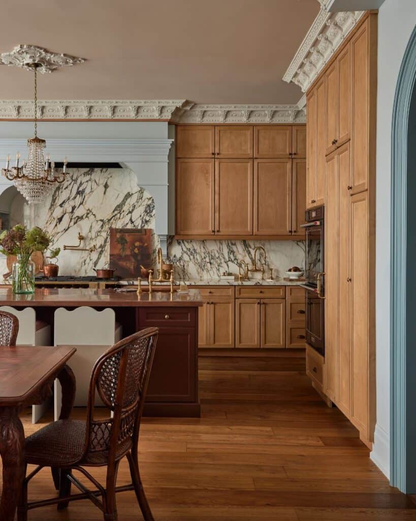 Kitchen with wooden cabinets, marble backsplash, and hardwood flooring.