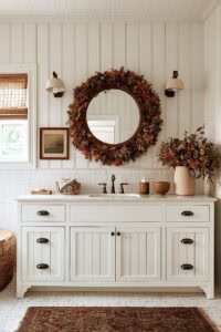 Bathroom with fall wreath, mirror, and autumn decor for cozy season.