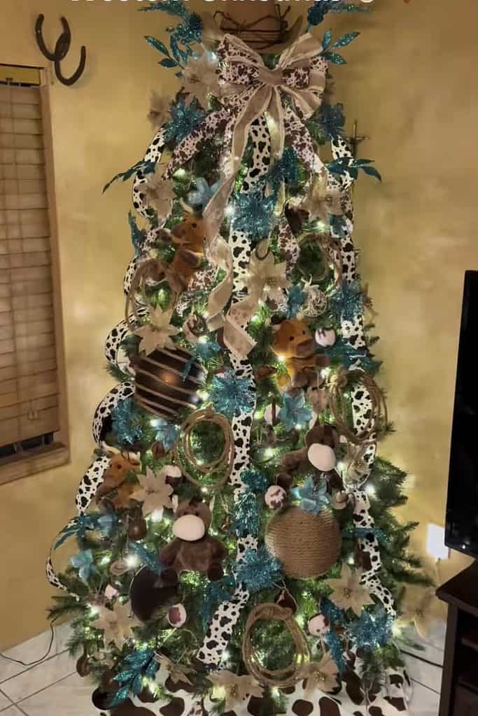 Festive Christmas tree decorated with ornaments, ribbons, and lights for holiday season.