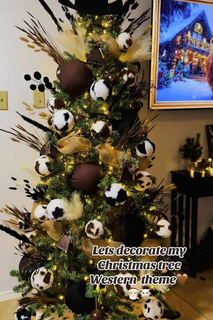 Festive Christmas tree with cow-themed ornaments and rustic decorations.
