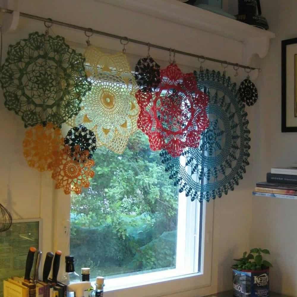Vibrant doilies hanging as decorative wall art in a cozy room.