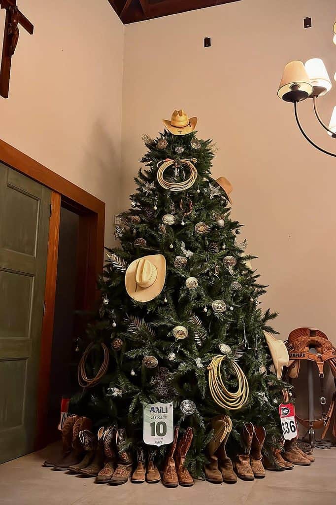 Decorated Christmas tree with cowboy hats, boots, and western-themed ornaments.
