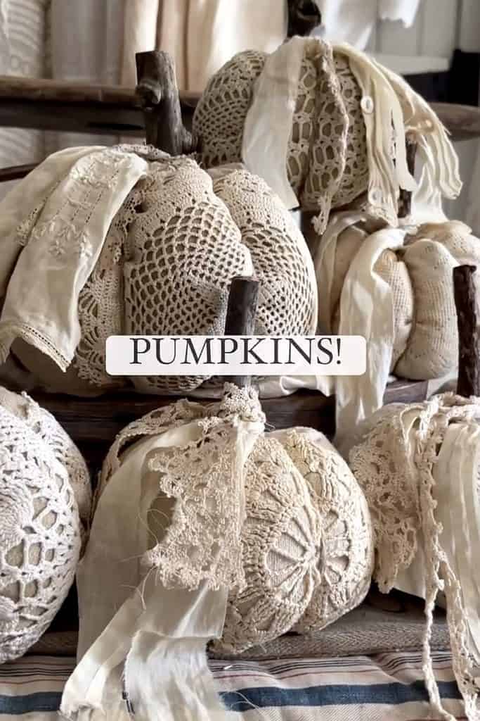 Decorative pumpkins covered with vintage doilies for fall decor.