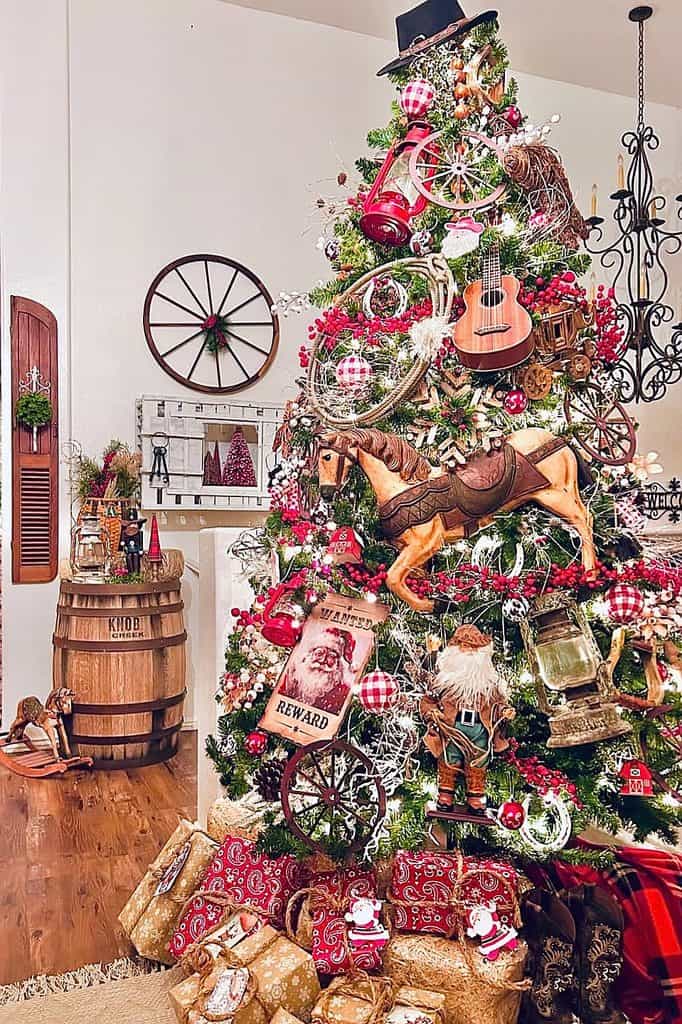 Decorated Christmas tree with vintage ornaments, horse figurine, and musical instruments.