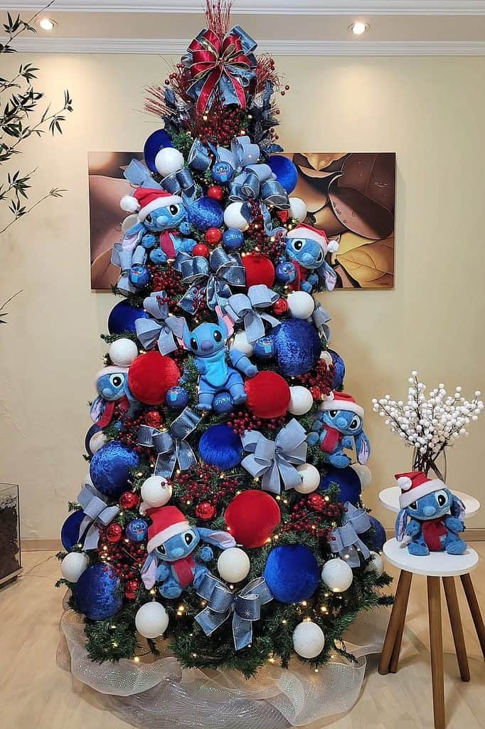 Christmas tree decorated with Disney Stitch plush toys, ribbons, and ornaments.