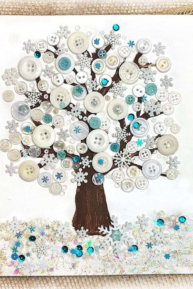 Festive Christmas button tree with snowflake accents and colorful buttons.
