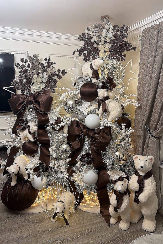 Cozy Christmas tree decorated with brown, white, and silver ornaments and plush bears.