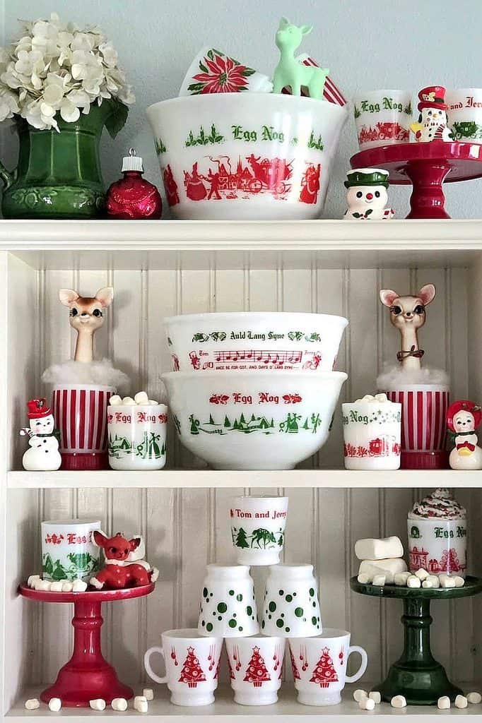Christmas-themed milk glass collection with holiday figurines and ornaments.