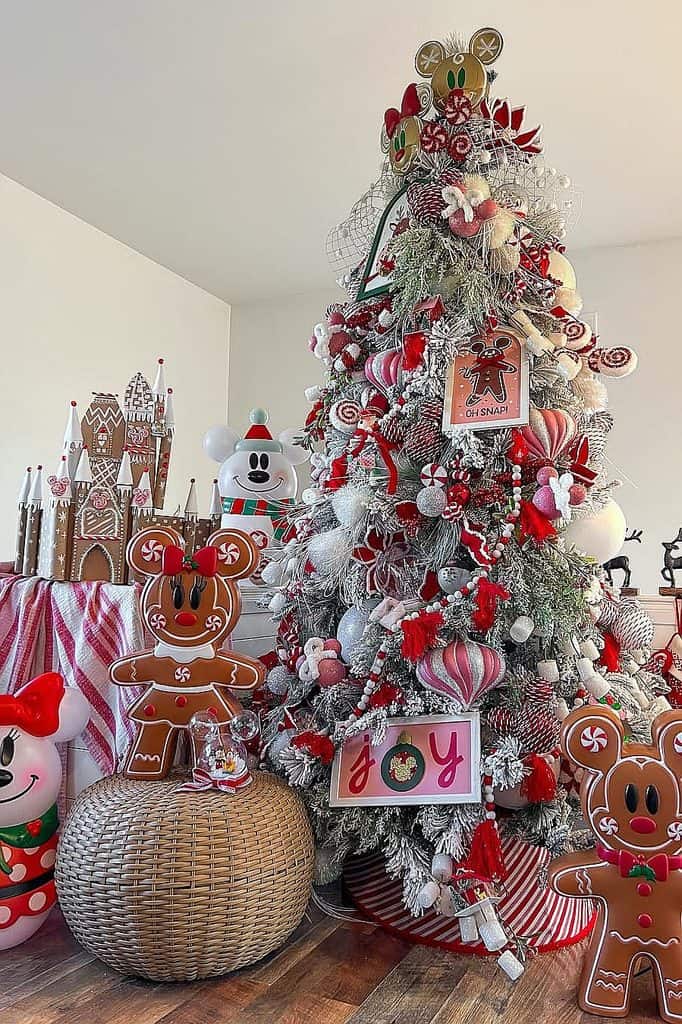 Decorated Christmas tree with gingerbread figures, ornaments, and holiday accents.
