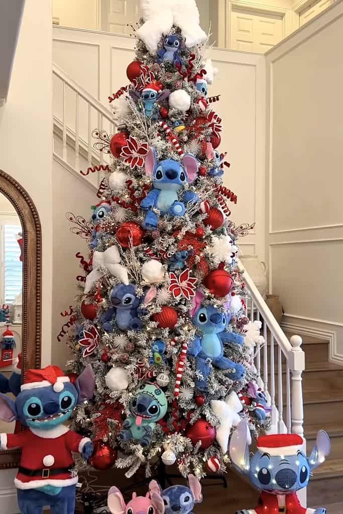 Decorated Christmas tree with Disney Stitch plush toys and ornaments.