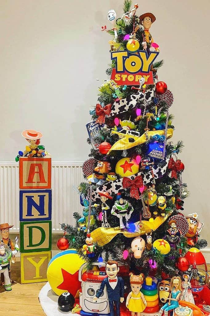 Colorful Toy Story themed Christmas tree with toys and ornaments for holiday decor.