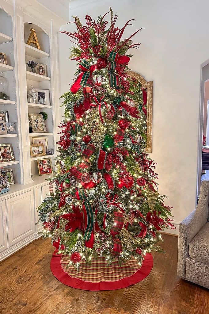 Beautifully decorated Christmas tree with red, green, and silver ornaments.